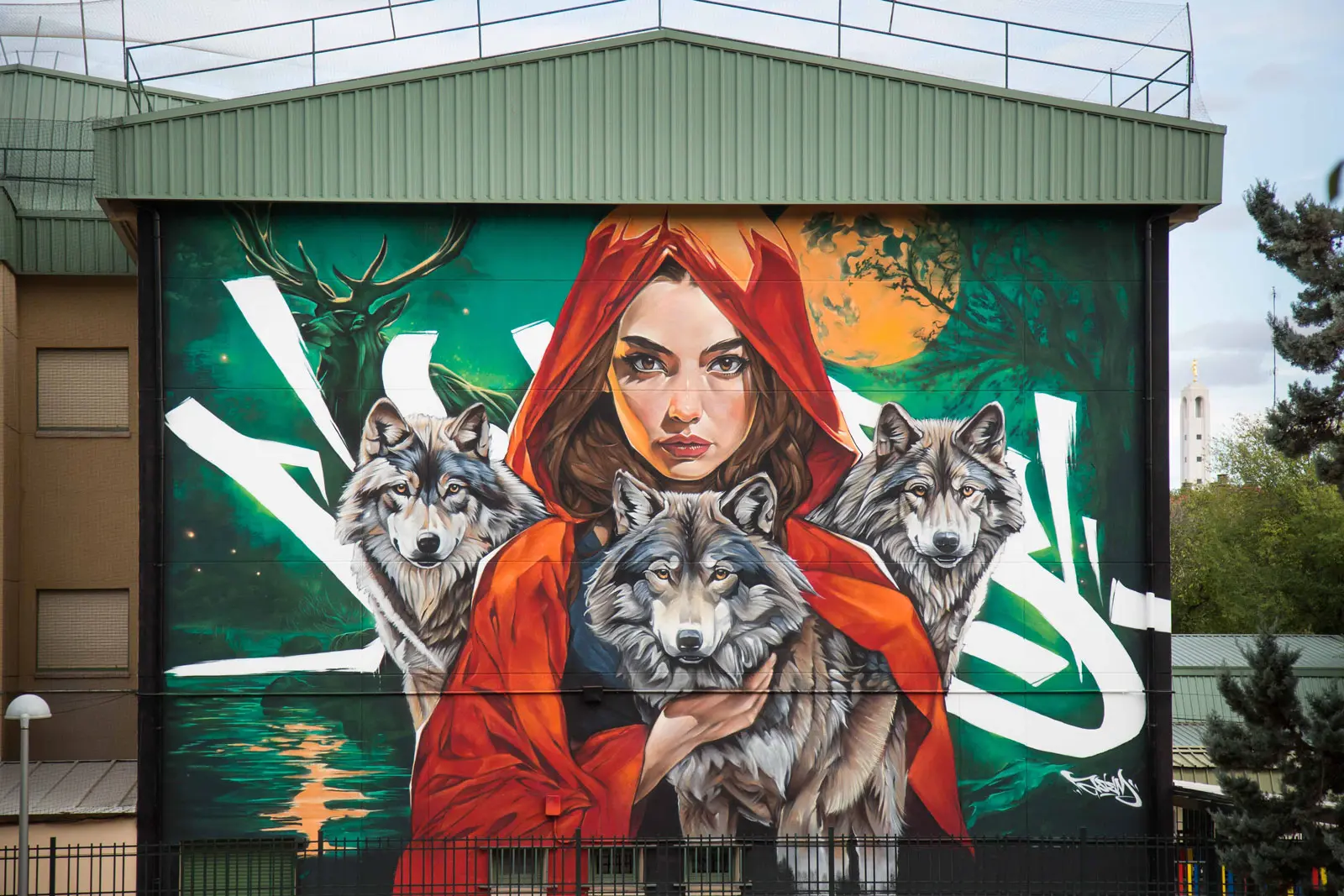 Mural Wolves Family pintado en el Colegio Martínez Montañés de Madrid