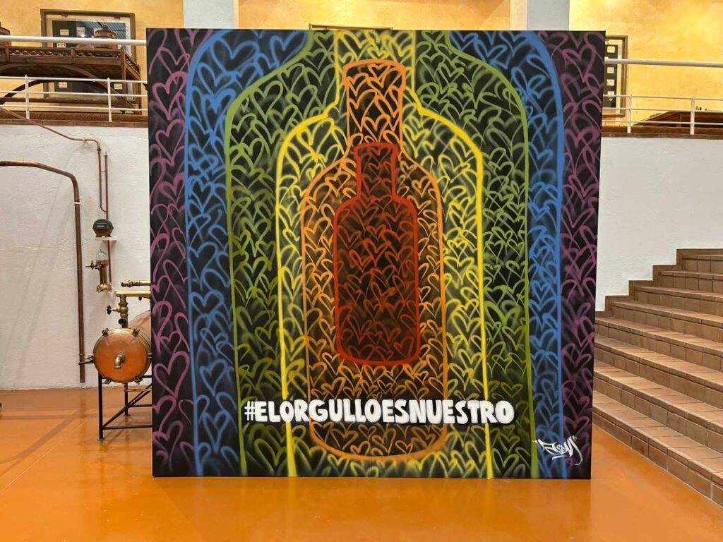 Photocall mural LGTBIQ+ en destilería de Pernod Ricard con mensaje El Orgullo Es Nuestro