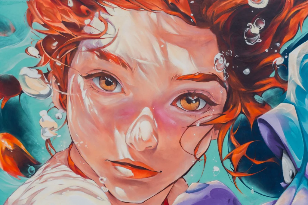 Arte urbano de temática pesquera en l'Ametlla de Mar, festival Efímurs