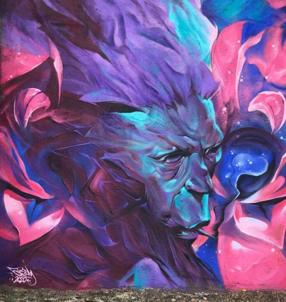 Graffiti estilo libre de demonio abstracto con tonos púrpura y azul