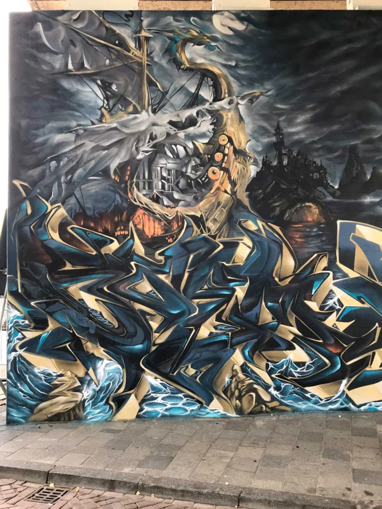 Graffiti artístico de barco y ciudad oscura en Dordrecht