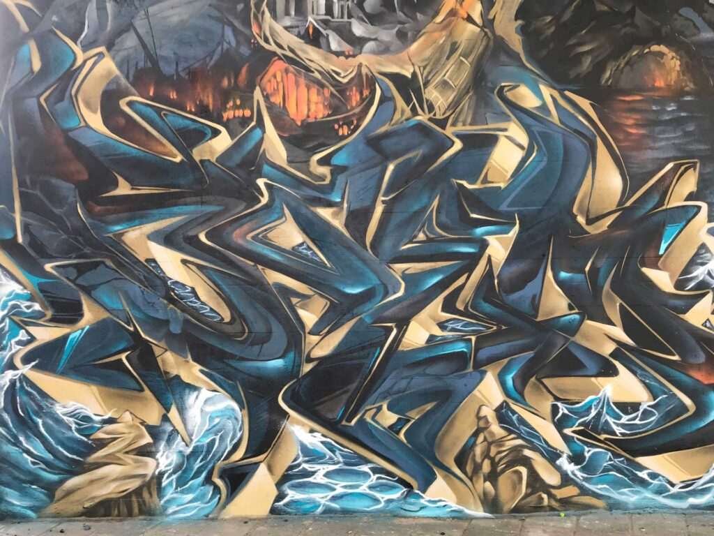 Graffiti artístico de barco y ciudad oscura en Dordrecht