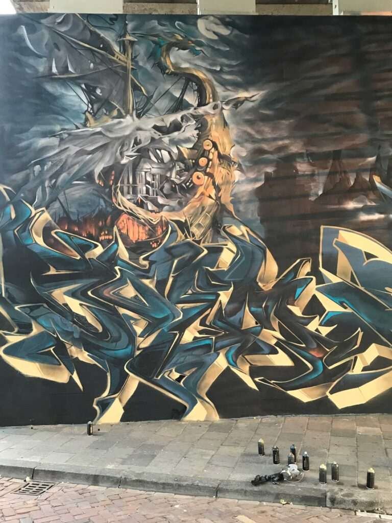 Graffiti artístico de barco y ciudad oscura en Dordrecht