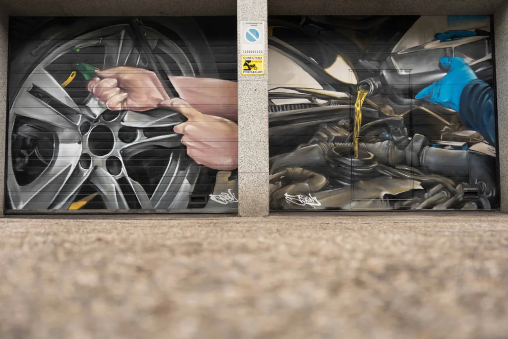 Mural mecánico realista en taller Euromaster Usera con motor y ruedas