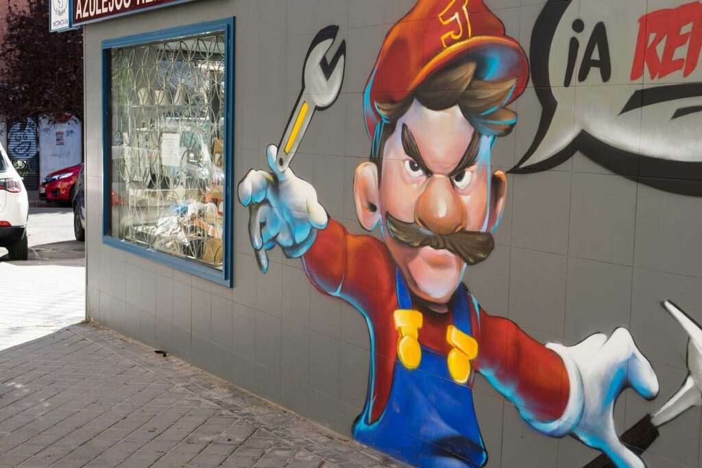 Mural para fontanería con personaje tipo Mario y herramientas, arte urbano comercial