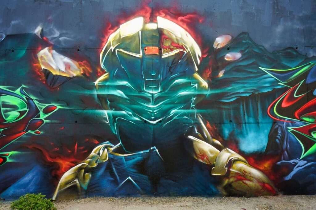 Mural de Dead Space con personaje futurista y graffiti profesional