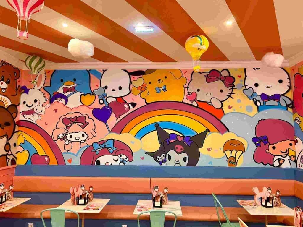 Mural kawaii en Kawaii Café Oviedo con personajes y repostería