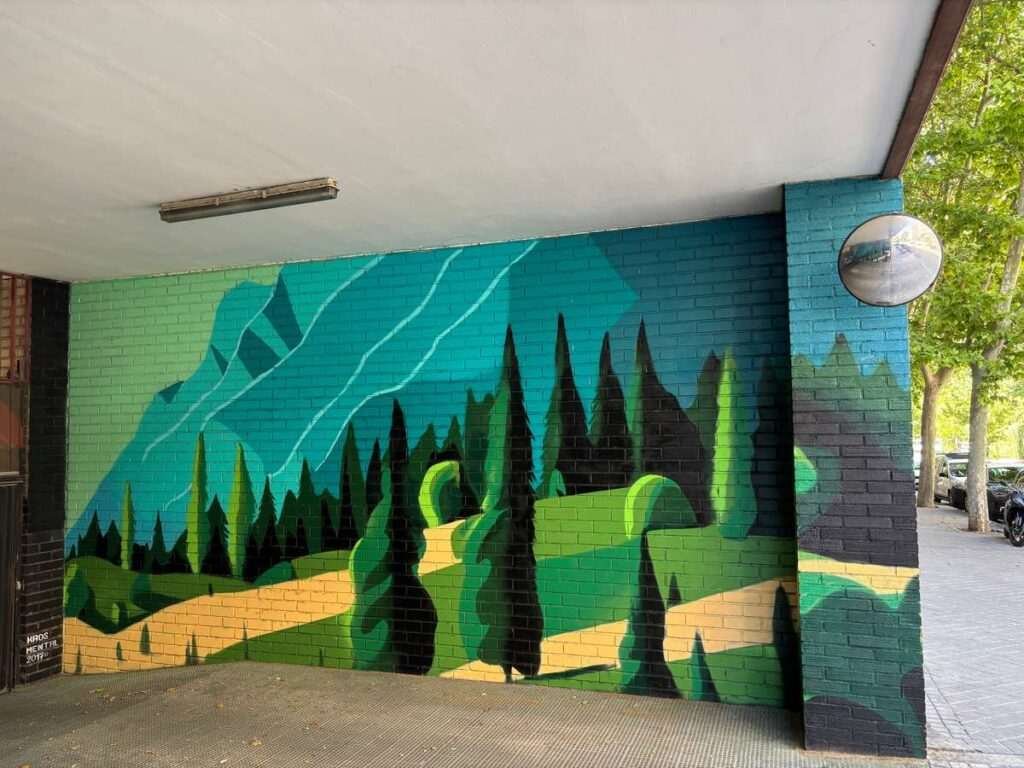 Graffiti de paisaje natural en garaje de comunidad en Madrid