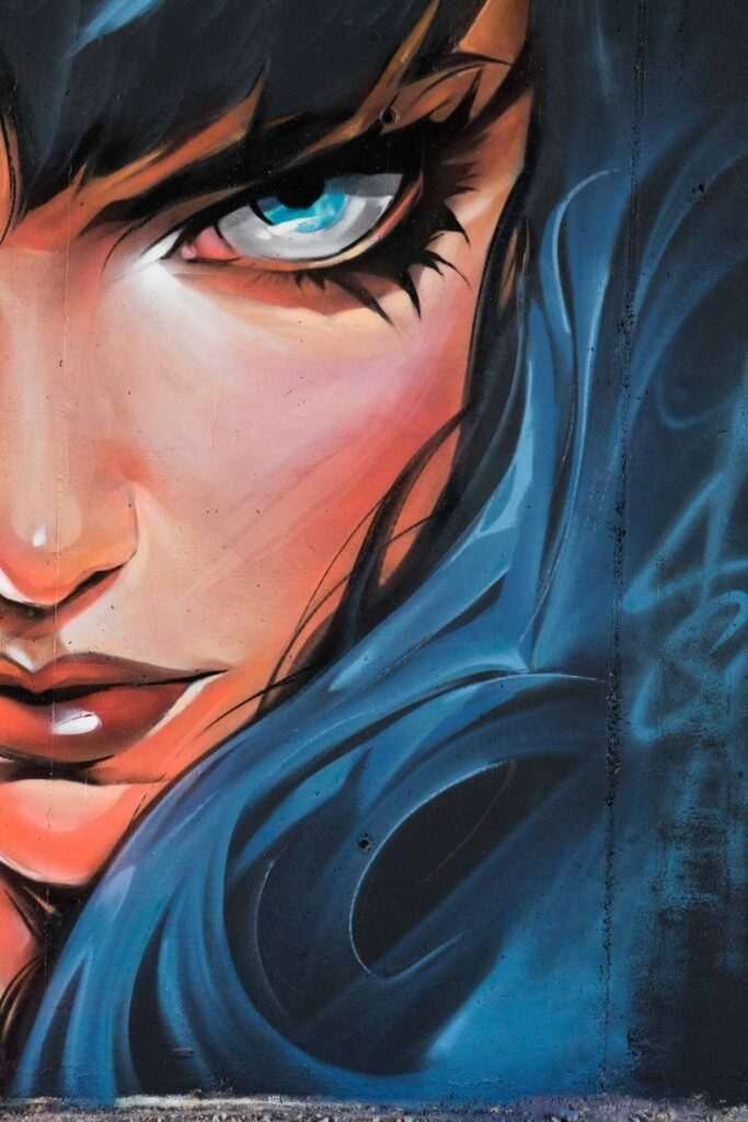 Retrato de mujer en mural de graffiti hiperrealista