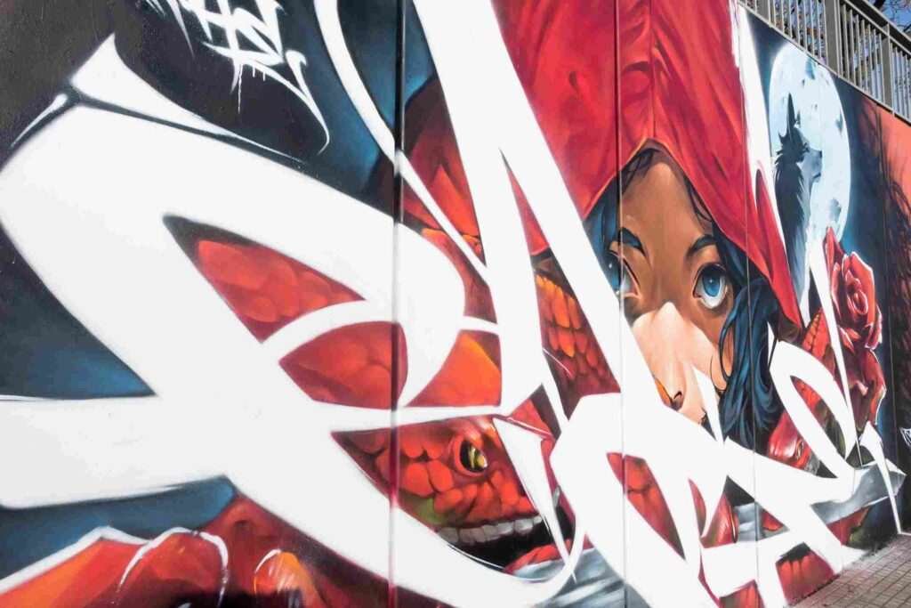 Mural graffiti de La Caputxeta Vermella en Les Franqueses del Vallès durante Enamurart