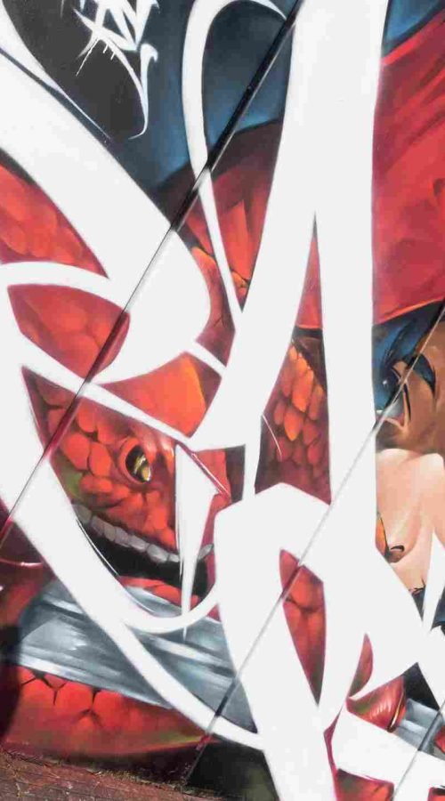Mural exterior de La Caputxeta Vermella realizado por Asem Navarro para Enamurart Graffiti Jam