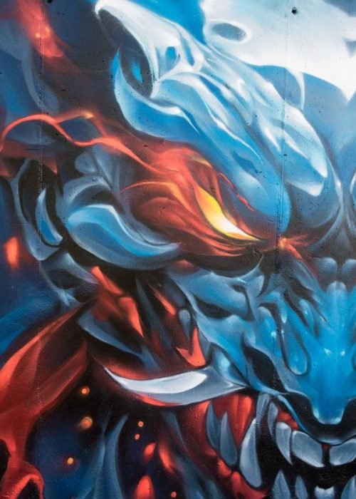 Graffiti de demonio japonés azul con ojos encendidos en Madrid