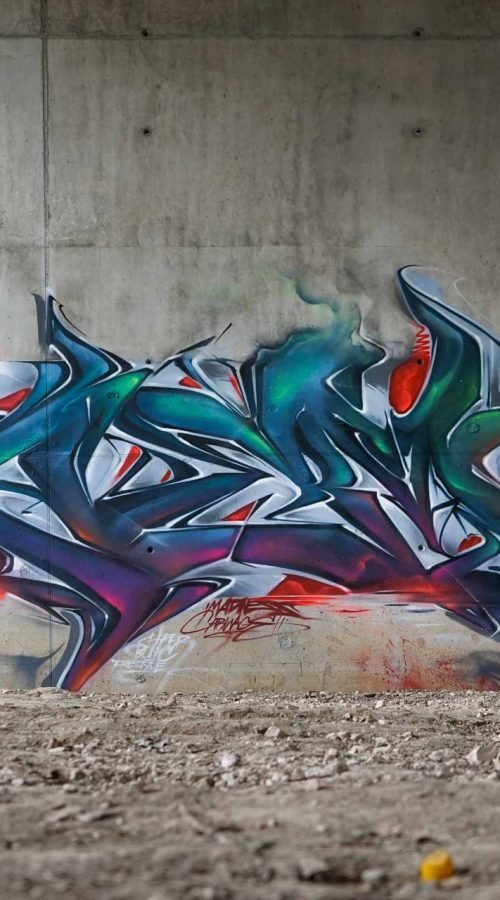 Mural graffiti 3D wildstyle con formas abstractas dinámicas