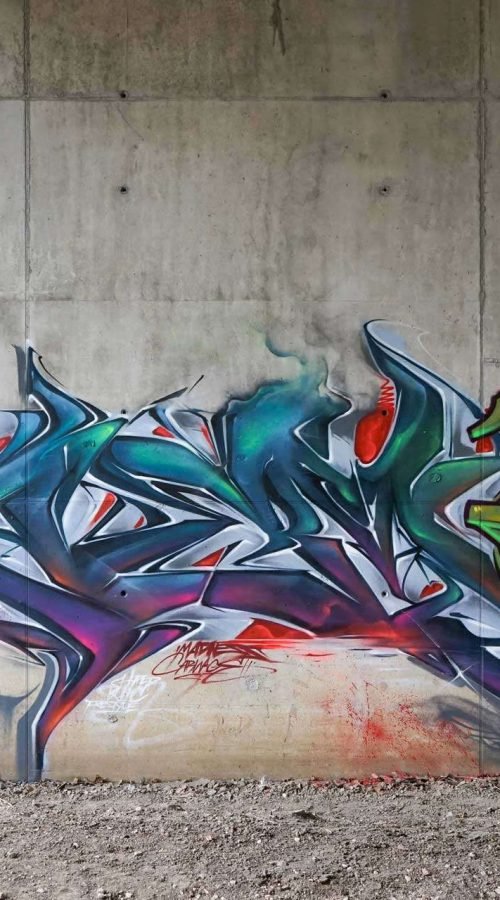 Mural graffiti 3D wildstyle con formas abstractas dinámicas