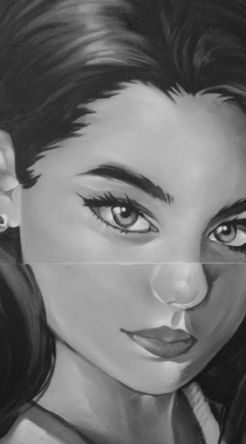 Graffiti de mujer en fachada de Oh Peluqueros en el Barrio del Pilar, Madrid