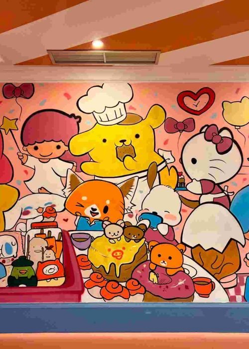 Mural kawaii en Kawaii Café Oviedo con personajes y repostería