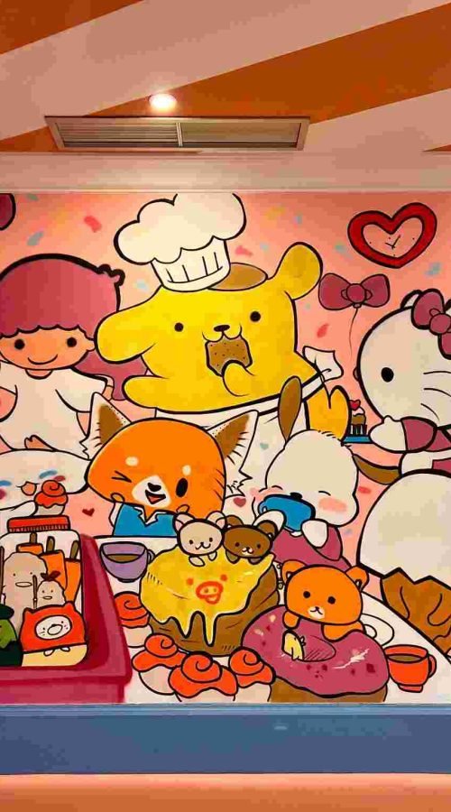 Mural kawaii en Kawaii Café Oviedo con personajes y repostería