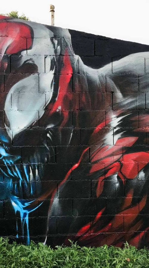 Mural urbano graffiti de Carnage, enemigo de Spiderman