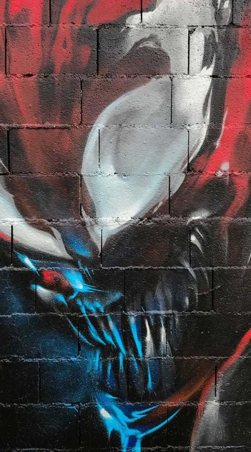 Mural urbano graffiti de Carnage, enemigo de Spiderman