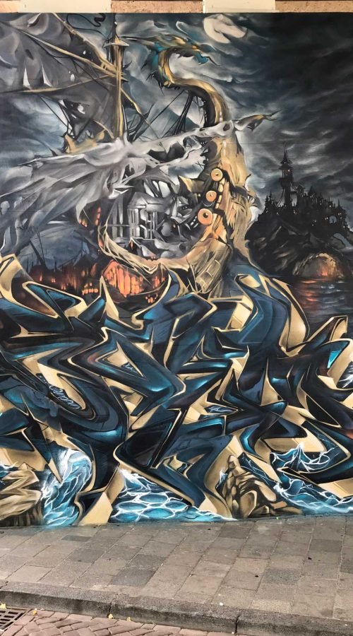 Graffiti artístico de barco y ciudad oscura en Dordrecht