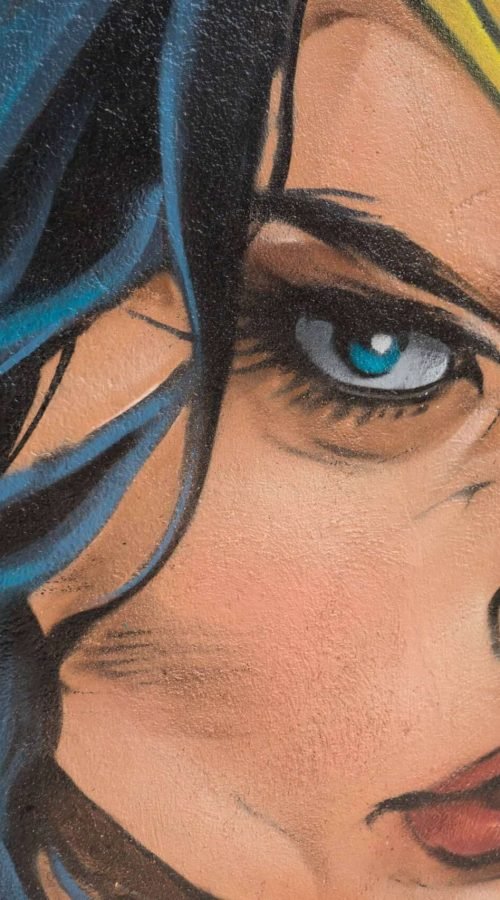 Mural en Akira Books Madrid con Spiderman, Goku, Wonder Woman, Luffy, Darth Vader y Black Panther