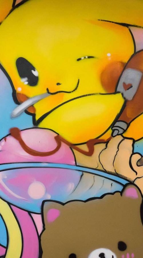 Mural kawaii con personajes japoneses en cafetería de Madrid