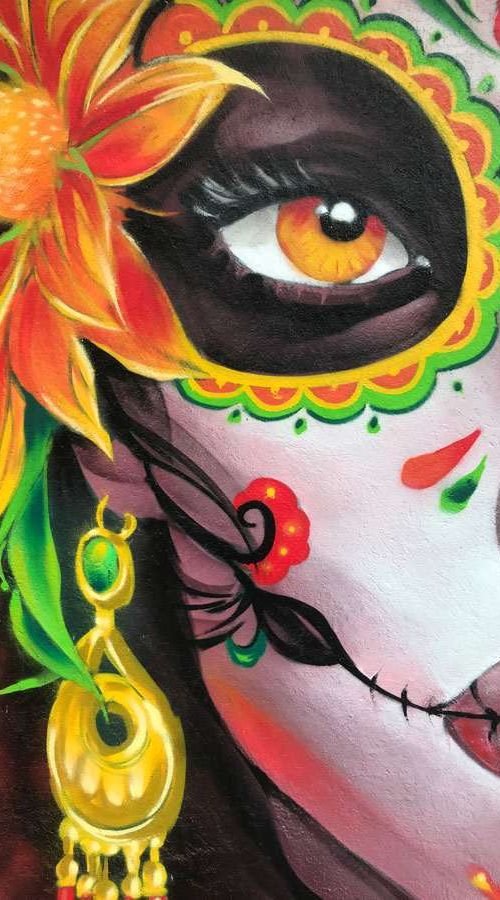 Mural con Catrina mexicana en restaurante, graffiti con color y cultura en Madrid