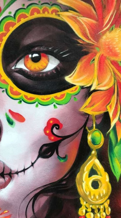 Mural con Catrina mexicana en restaurante, graffiti con color y cultura en Madrid