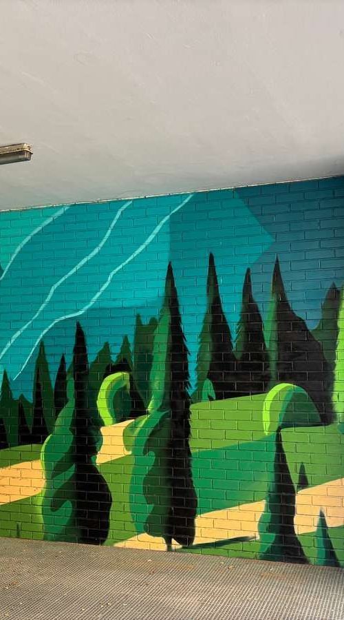 Graffiti de paisaje natural en garaje de comunidad en Madrid