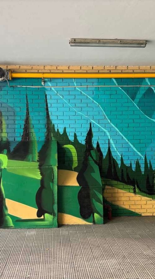 Graffiti de paisaje natural en garaje de comunidad en Madrid