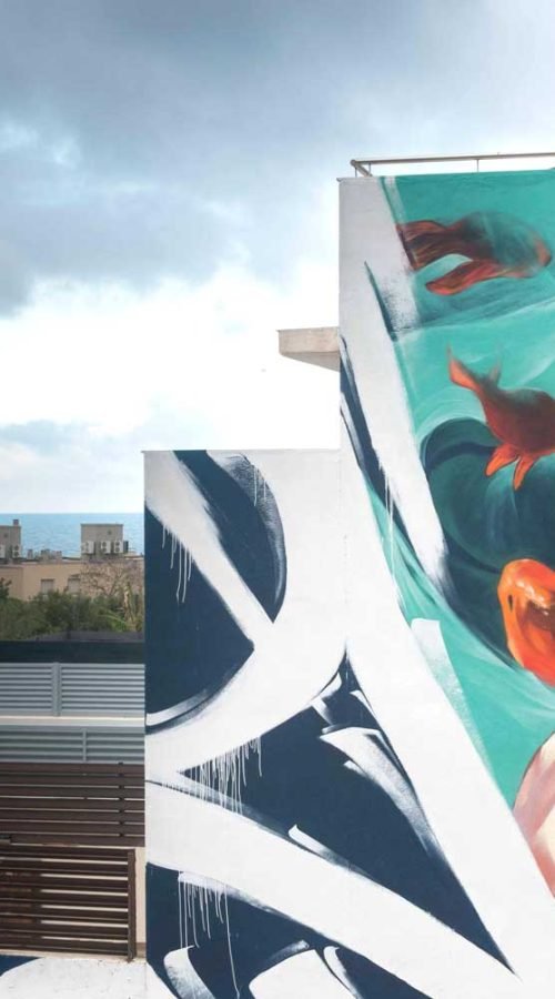 Graffiti de La Sirenita en fachada pública de L’Ametlla del Mar , Cataluña